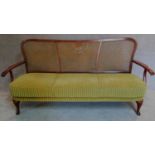 A mid 20th century bergere caned sofa, makers label to base. H.86 W.170 D.60cm