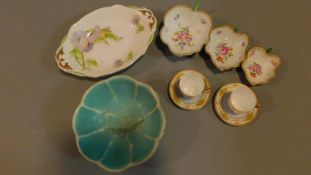 A collection of ceramics to include a painted and signed serving dish, a set of three hand painted