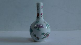 A Chinese mid 20th century bottle vase decorated with butterflies and flowers, red seal mark to