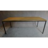 An industrial style dining table with oak top and metal legs and frame. H.76 W.200 D.79cm