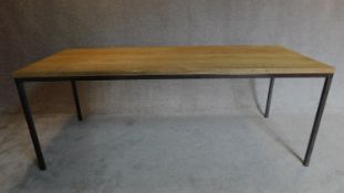 An industrial style dining table with oak top and metal legs and frame. H.76 W.200 D.79cm