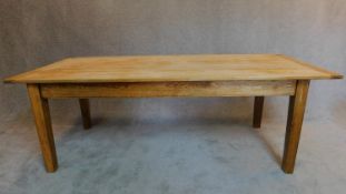 An oak planked top refectory style dining table. H.76 W.214 D.91cm