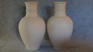 A pair of Persian Hamadan storage pots with studded collars. H.83 W.50cm