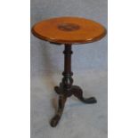 A Victorian inlaid circular top occasional table. 63x44cm