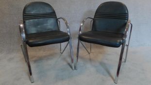 A pair of chrome framed office armchairs. 87x60x54cm