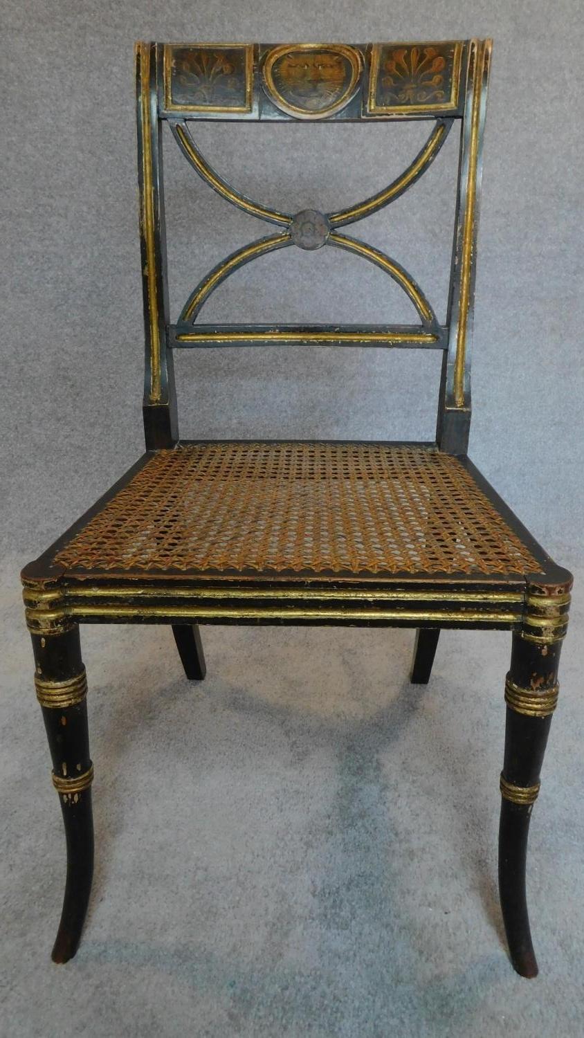 A pair of Regency ebonized and part gilt painted chairs with cane seats, the X-framed back rests - Image 2 of 6