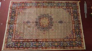 A north east Persian Moud carpet, central double pendant medallion with repeating hertie motifs on