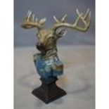 A moulded bust of a stag in military officer's uniform