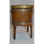 A Georgian mahogany brass bound wine cooler on stand. (missing liner). H.75 W.52 D.44cm
