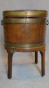 A Georgian mahogany brass bound wine cooler on stand. (missing liner). H.75 W.52 D.44cm