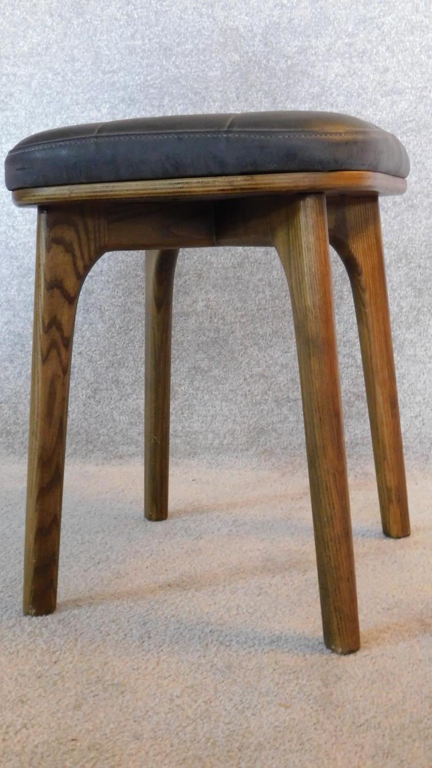 A pair of vintage 1970's ash stools upholstered in buttoned charcoal leather 47x37x37 - Image 2 of 5