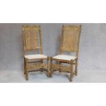 A pair of antique oak side chairs, allover carving, caned back and seats. H.110cm