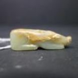 A 19th century Chinese carved jade pendant in the form of a pig, H.1.6 W.5 D.1.2cm