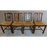 A set of four mid 20th century oak dining chairs. H.88 W.44 W.39cm