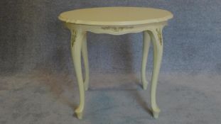A white painted French style centre table. H.60 W.70cm