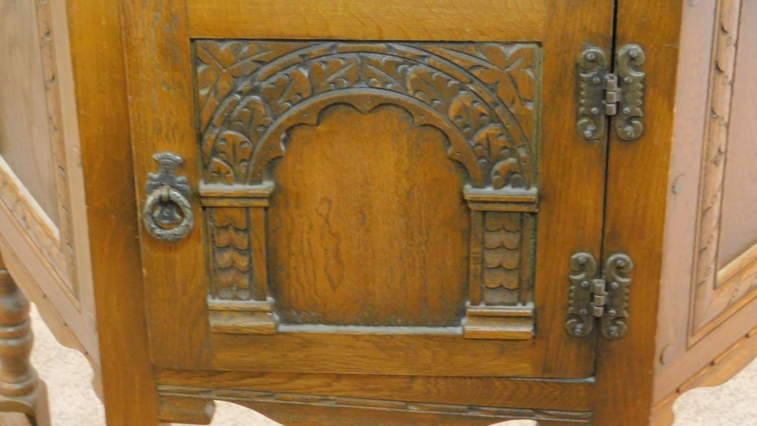 A small Jacobean style court cupboard fitted carved panel door. H.70 W.80 D.33cm - Image 3 of 4