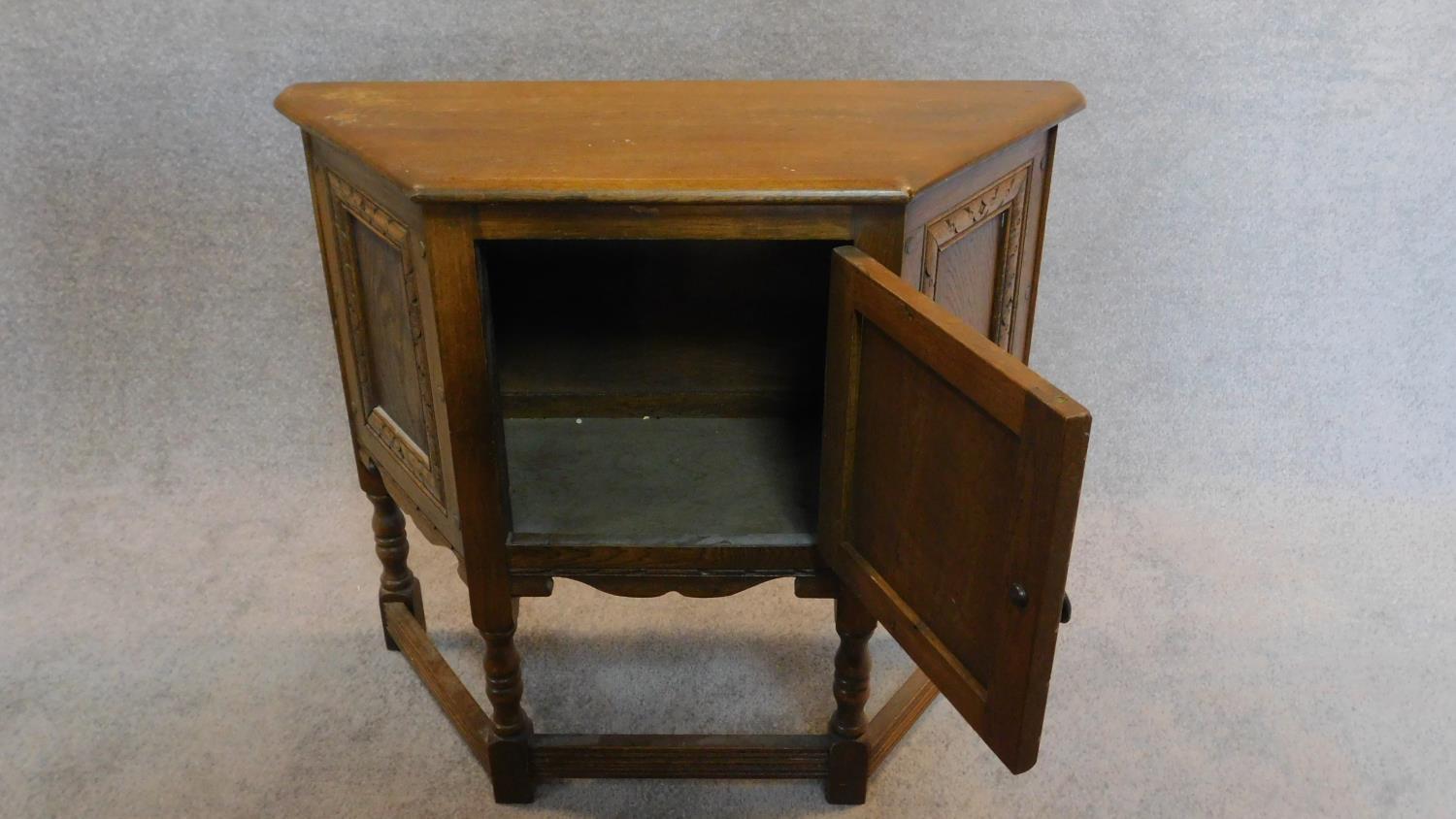 A small Jacobean style court cupboard fitted carved panel door. H.70 W.80 D.33cm - Image 2 of 4