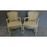 A pair of white painted French style armchairs. H.93 W.60 D.52cm
