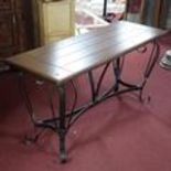 A French wrought iron console table with mahogany top, H.78 W.154 D.55cm