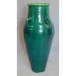 A large green glazed sharab wine vessel. H.90 W.40cm