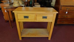 A teak Art Nouveau style side table H.77 W.85 D.35