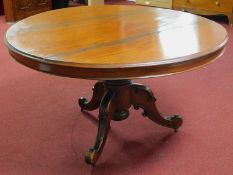 A Victorian mahogany circular breakfast table, on turned support and outswept legs on castors, H.