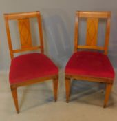 A pair of 19th century Beidermeier style satin birch dining chairs with ebony stringing. H.94cm