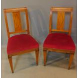 A pair of 19th century Beidermeier style satin birch dining chairs with ebony stringing. H.94cm