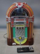 A CD Juke Box, with remote control, H.52 W.32 D.23cm