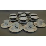 A set of 8 vintage German soup bowls and saucers marked Thomas Germany and a set of 4 coffee cups