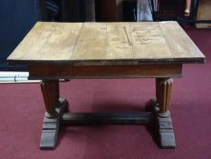 A 19th century oak draw leaf dining table, raised on reeded supports joined by stretcher, H.72 W.200