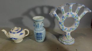 A Chinese blue and white vase. a teapot and a majolica 5 stem spill vase. H.37 (tallest)