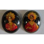 A pair of hand painted Indian brooches. 5x4cm