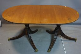 A 19th century mahogany D-end dining table, raised on twin pillar supports and splayed legs, H.160