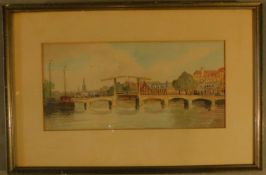 A framed and glazed watercolour of a Dutch canal scene, indistinctly signed. H.32 W.49cm