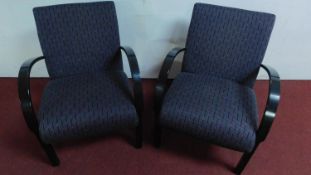 A pair of upholstered retro design armchairs H.82 W.62cm