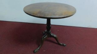 A late Georgian mahogany circular tilt top table on tripod cabriole supports. H.71 W.73cm