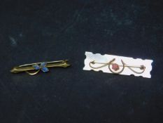 A stone inset 9ct gold brooch together with another stone set brooch