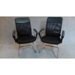A pair of chrome tubular framed office chairs. 103x60x50cm