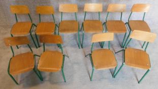 A set of 10 vintage childrens's metal framed stacking chairs with plywood seats and backs. H.53cm