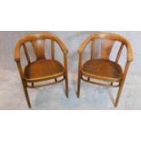 A pair of early 20th century bentwood armchairs by Thonet, label and stamp to bottom. H.77cm