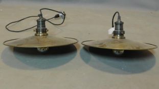 A pair of industrial style circular brass ceiling light pendants, D.40cm