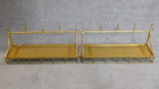 A pair of gilt framed wall hanging shelves. 34x56cm