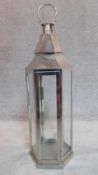 A tall metal storm lantern. H.88cm