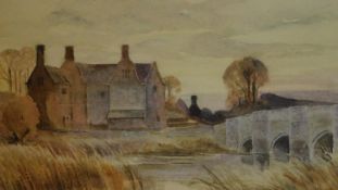 A framed and glazed watercolour of houses by a lake, signed H. G. Hine. 33x42cm