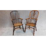 A pair of antique Windsor yew armchairs, pierced splat and crinoline stretchers with elm seats and