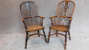 A pair of antique Windsor yew armchairs, pierced splat and crinoline stretchers with elm seats and