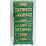 A Chinese green lacquered and gilt decorated narrow chest of drawers. H.70 W.30 D.22cm
