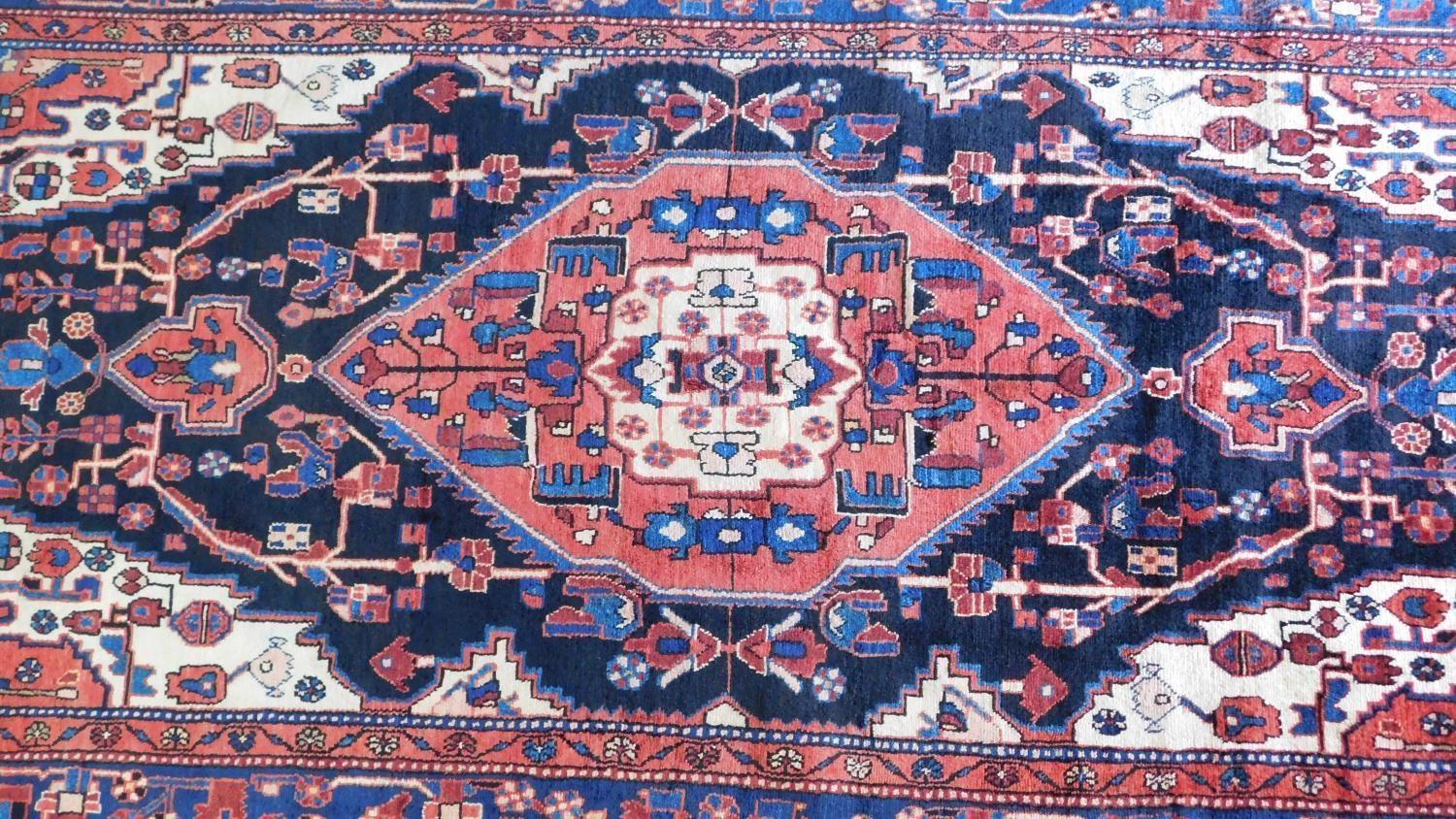 A north west Persian Nahawand carpet with central double pendant medallion with repeating petal - Image 2 of 4