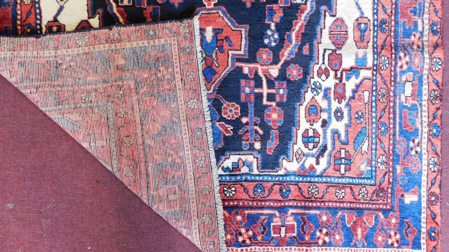 A north west Persian Nahawand carpet with central double pendant medallion with repeating petal - Image 3 of 4